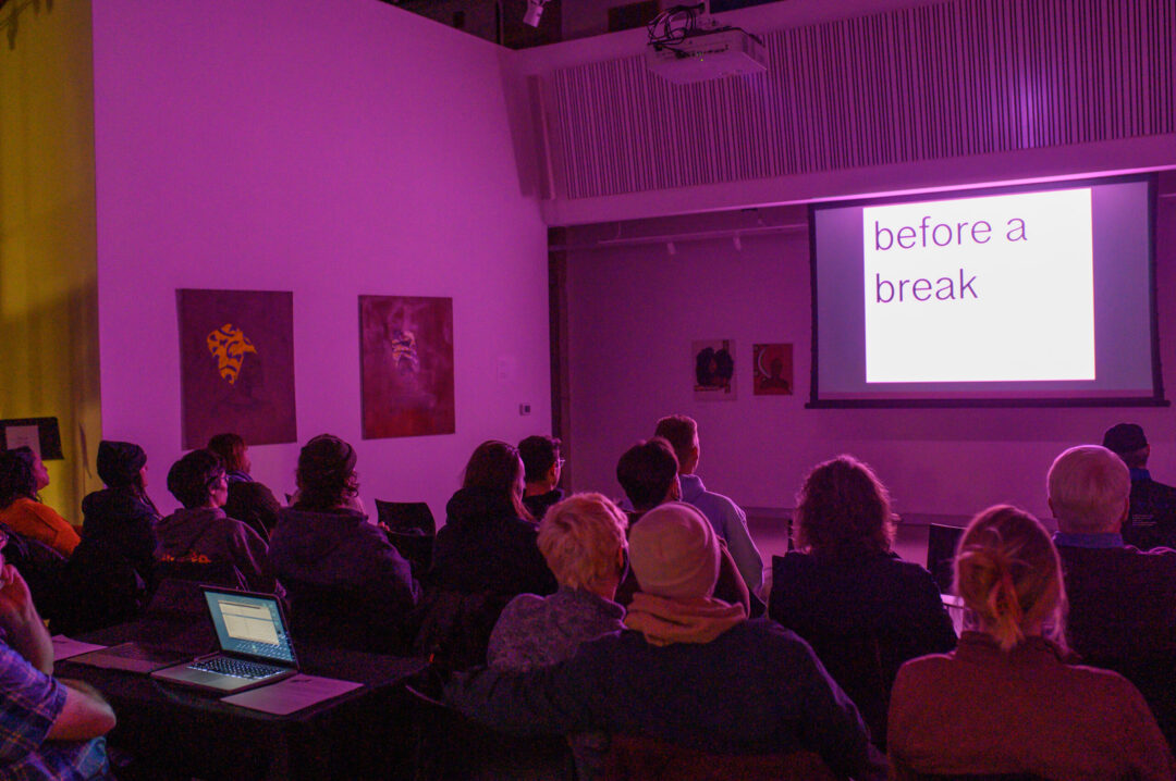 Audience watches videos by Ariel Teal at Mills Folly Microcinema screening